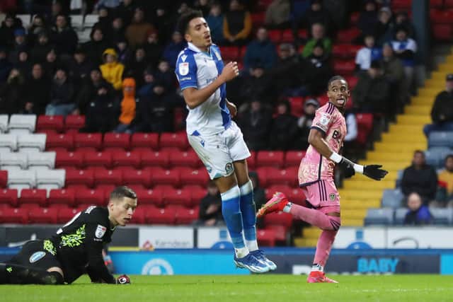 CLINICAL: Whites winger Crysencio Summerville, right, sees his deft flick over Blackburn Rovers keeper Leopold Wahlstedt hit the back of the net to put Leeds United out of sight in Saturday's Championship clash at Ewood Park. Photo by Tim Markland/PA Wire.