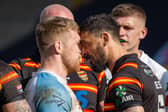 Hunslet's Sam Hallas, left, goes head to head with Paul Sykes, of Dewsbury. Picture by Paul Whitehurst.
