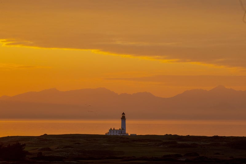 Golden skies beyond the Trump Turnberry lighthouse on Scotland's west coast were captured as the weather warmed up this weekend.
