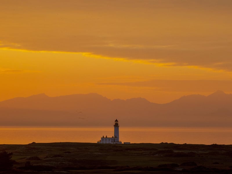 Golden skies beyond the Trump Turnberry lighthouse on Scotland's west coast were captured as the weather warmed up this weekend.