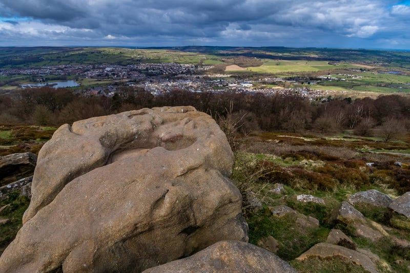 The distinguished weathered rock formations found  on the south side of the Wharfedale valley overlooking the market town. On a clear day you can see Simons Seat, Norwood Top, Almscliffe Crag and the White Horse near Sutton Bank from the worn-out path running along the top edge from Surprise View a well known picnic spot.