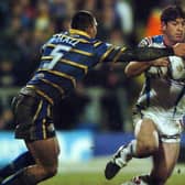 Jason Demetriou, of Wakefield Trinity, attempts to evade Leeds Rhinos' Ryan Hall in February, 2009. Picture by Jonathan Gawthorpe.