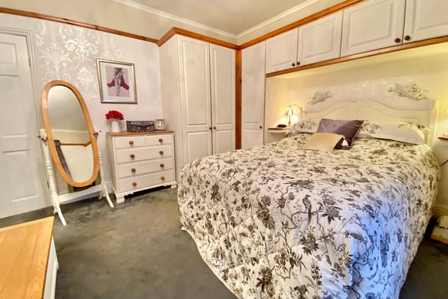 The master bedroom has front facing window, built in wardrobes and over-the-bed built in cupboards.