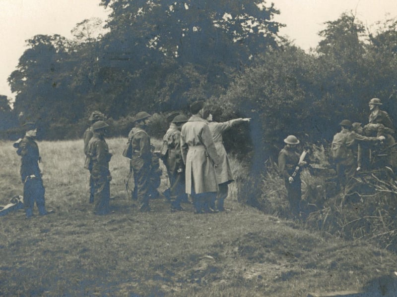 The image is titled 'Demonstration Team, Golden Acre'. Leeds Sub-area School of Tactics taught hundreds of officers and senior NCOs in Golden Acre Park. They are possibly demonstrating to US officers.