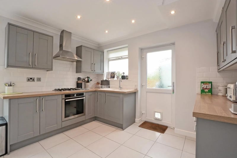 The kitchen also features easy access to the back graden.