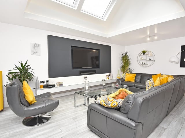 A modern and relaxed TV room within the property.