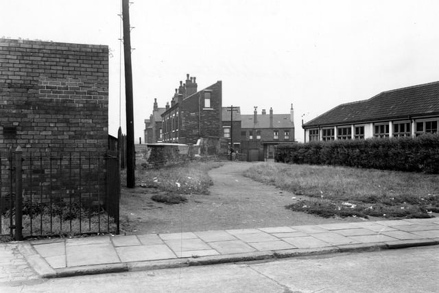 Looking north-north-east from Derbyshire Street. On the right the side of Hunslet Nursery; to the left an electricity sub station. Pictured in August 1953.