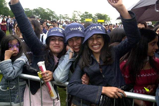 The Leeds Mela, held at Roundhay Park on Sunday, August 11, 2002. Pictured left to right is Sophia Qayum, Uswah Ayyaz, and Tusmia Qayum, waiting for the concert to begin. Picture: James Hardisty.