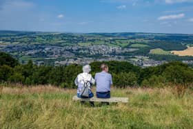 A couple take in the vista at Surprise View on Otley Chevin, one of five locations earmarked by Leeds City Council to introduce car parking charges in parks across the city region, photographed for The Yorkshire Post by Tony Johnson.