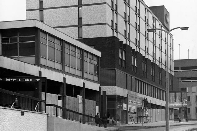 The Merrion Hotel on Wade Lane with the Merrion Centre below. On the left a sign directs towards the subway and toilets now disused.
