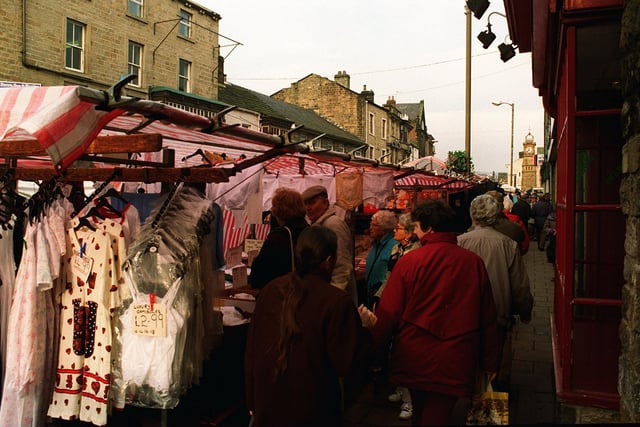 Otley market stalls crowd close to the stalls and shops on Kirkgate during Friday market day in January 1997.