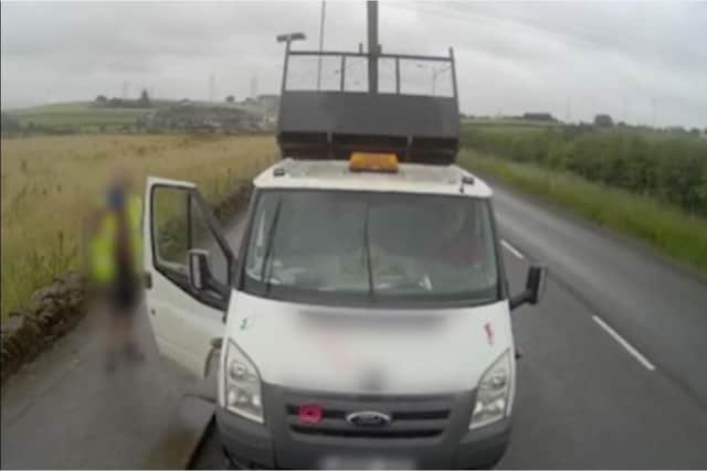 He raised the bed of his tipper truck to obstruct the camera operator. Picture: WYP