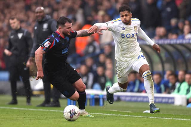 NIGHTMARE: For Huddersfield Town defender Tom Edwards, left, against Leeds United's attackers including Georginio Rutter, right, in Saturday's Championship derby at Elland Road. Photo by George Wood/Getty Images.