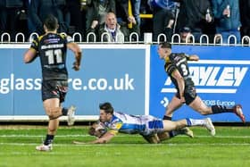 Paul Momirovski, seen scoring during Leeds Rhinos' win at Castleford Tigers in March, is back in the squad for Saturday's rematch. Picture by Allan McKenzie/SWpix.com.