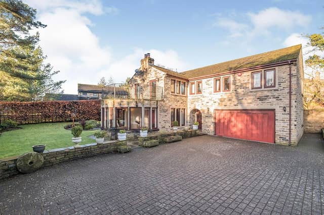 The impressive frontage of the stone detached property.