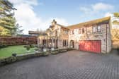 The impressive frontage of the stone detached property.