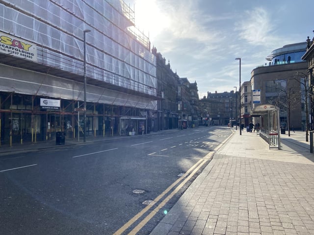 Does this usually bustling city centre street look familiar? A deserted Boar Lane.