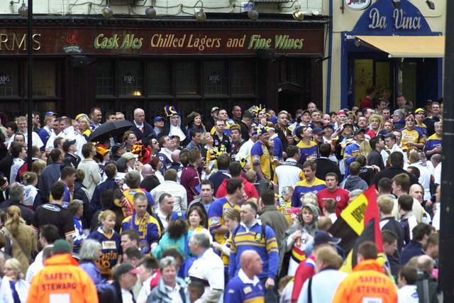 Fans gather outside the stadium in Cardiff, Wales, to watch Leeds Rhinos V Bradford Bulls in the Challenge Cup Final, in 2003.