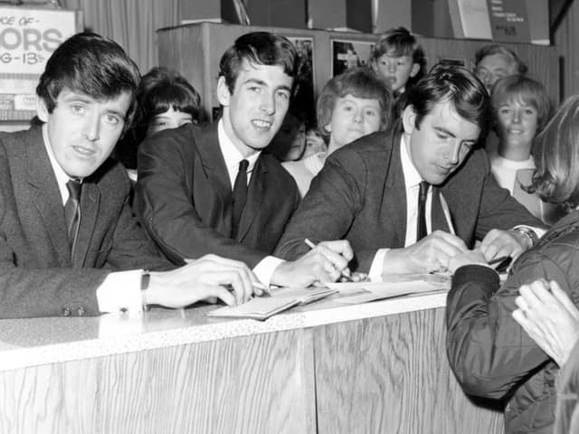 The Bachelors are pictured signing autographs and copies of their latest record. In 1964 the Bachelors released the singles, 'Diane', 'Ramona', 'I believe', 'I Wouldn't Trade You For The World', and 'No Arms Could Ever Hold You'.
