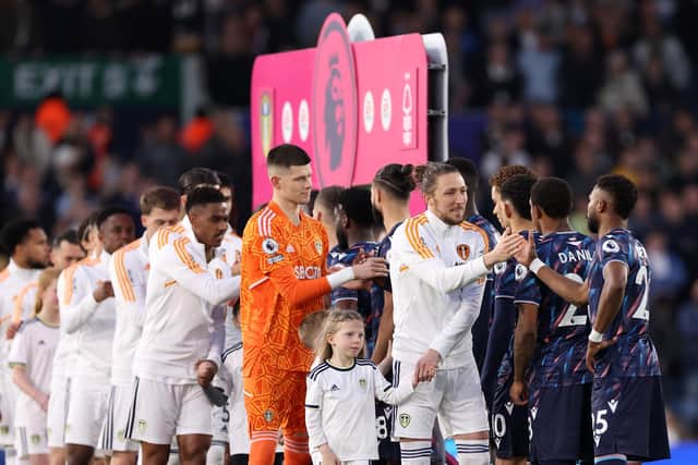 LEEDS, ENGLAND - APRIL 04: Luke Ayling of Leeds United and teammates shake hands with the Nottingham Forest players prior to the Premier League match between Leeds United and Nottingham Forest at Elland Road on April 04, 2023 in Leeds, England. (Photo by Alex Livesey/Getty Images)