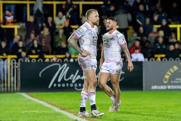 Blake Austin and James Bentley show their disappointment after Rhinos' loss at Castleford. Picture by Allan McKenzie/SWpix.com.