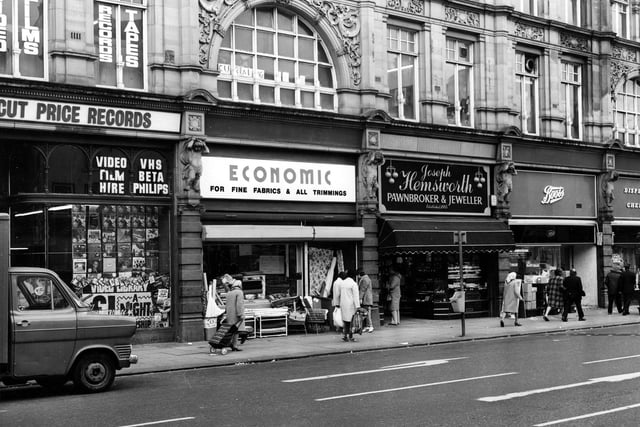 Kirkgate Market seen from Vicar Lane in May 1984. Pictured, from left, is Cut Price Records then Economic Woollen Company, fabrics, then Joseph Hemsworth, jeweller and Boots the chemist.