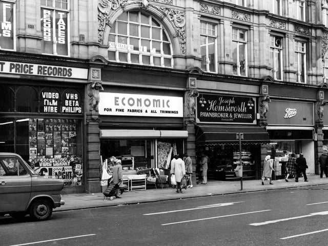Kirkgate Market seen from Vicar Lane in May 1984. Pictured, from left, is Cut Price Records then Economic Woollen Company, fabrics, then Joseph Hemsworth, jeweller and Boots the chemist.