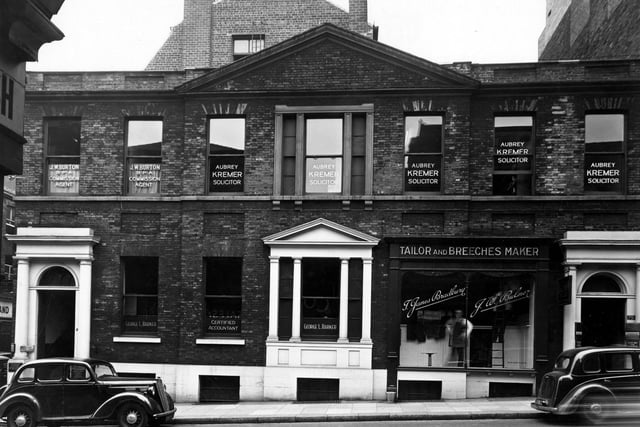 Albion Street in August 1949. Shops and businesses in focus include George L. Barker, accountant and Bradbury & Bulmer, tailors and breeches makers. Above are the premises of J.W. Burton, commission agent and Aubrey Kremer, solicitor.