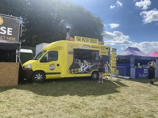 A pizza is a staple festival meal and The Pizza Truck offers various wood fired options.