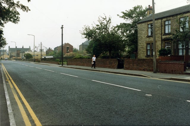 A mean walks along  Bradford Road in September 1990.