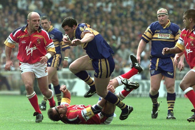 Rhinos' young forward Adrian Morley makes mincemeat of the London defence.