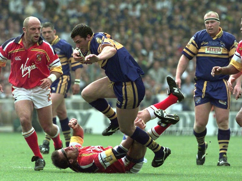 Rhinos' young forward Adrian Morley makes mincemeat of the London defence.