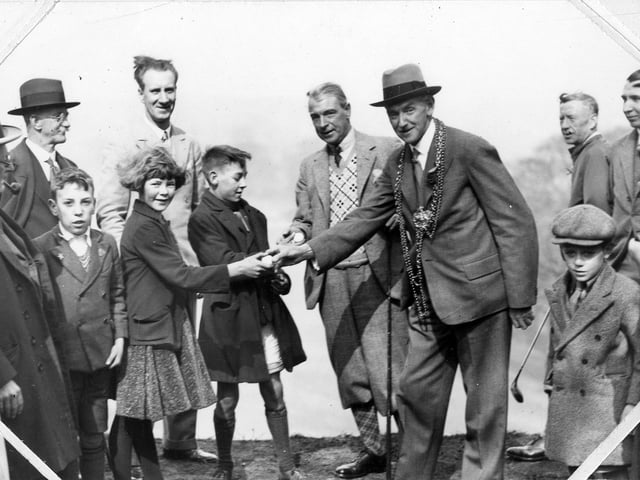 The Lord Mayor of Leeds, Alderman Robert H Blackburn, along with Alderman Alf Masser, meeting a group of children at the opening ceremony of Gotts Park golf course.