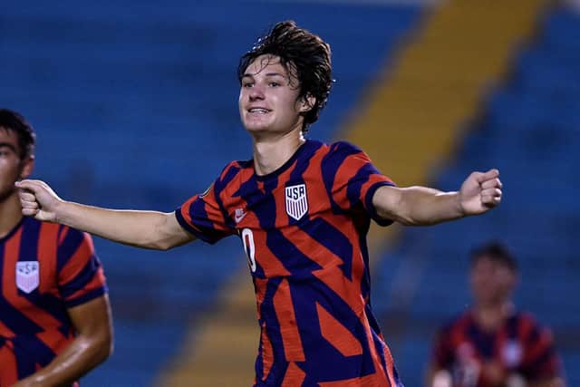 US' Paxten Aaronson celebrates after scoring against Dominican Republic during their CONCACAF Under-20 Championship football final, at the Olimpico Metropolitano stadium in San Pedro Sula, Honduras, on July 3, 2022. (Photo by Orlando SIERRA / AFP) (Photo by ORLANDO SIERRA/AFP via Getty Images)