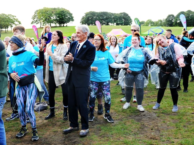 Former Leeds United player Alan Peacock joins the warm up with the walkers