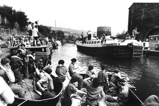 Army cadets of the Duke of Wellington's Regiment Halifax, taking part in assault races at the Sowerby Bridge Water Festival in June 1973 relax as a converted working barge, the Elizabeth B, arrives in the canal basin.