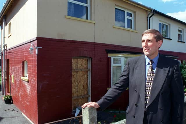 Lead investigator Detective Superintendent Eddie Hemsley outside the couple's home in the days after the fire.