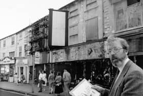 The First White Cloth Hall on Kirkgate was built in 1711 for the sale of undyed cloth, a role successively taken on by the second, third and fourth White Cloth Halls. Today only the first and third survive. Pictured here is the chairman of Leeds Civic Trust, Dr. Kevin O'Grady, outside the hall in 1991.