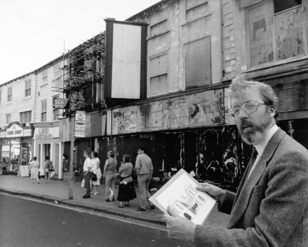The First White Cloth Hall on Kirkgate was built in 1711 for the sale of undyed cloth, a role successively taken on by the second, third and fourth White Cloth Halls. Today only the first and third survive. Pictured here is the chairman of Leeds Civic Trust, Dr. Kevin O'Grady, outside the hall in 1991.