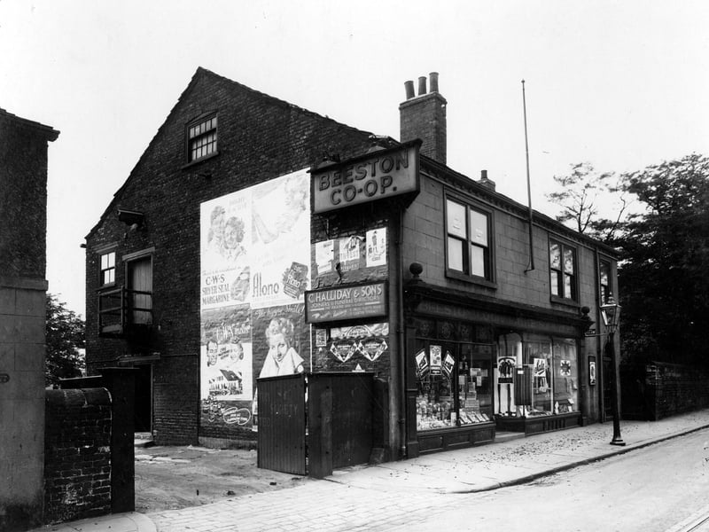 Beeston Co-operative Society on Town Street in July 1939. The entrance to yard of C.Halliday & Sons, Joiners and funeral directors can be seen on the left.