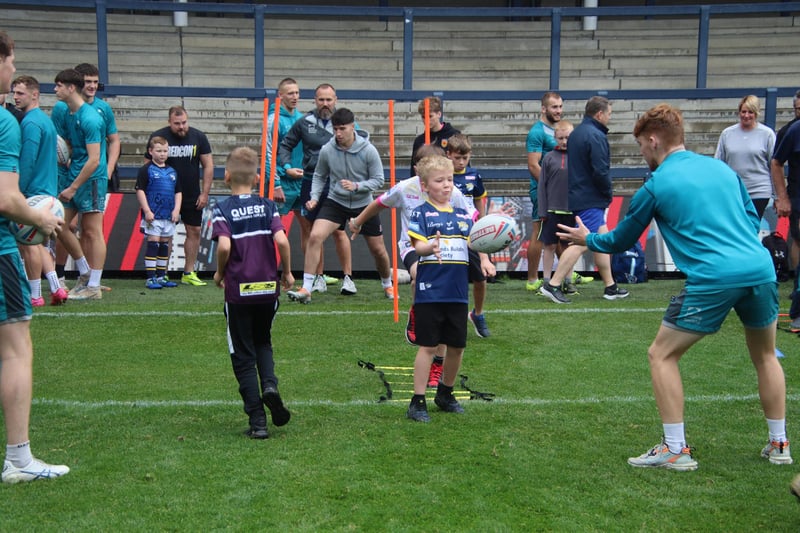 A young fan works on his skill at Rhinos' sponsors' training day.
