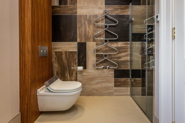 A modern and stylish en suite bathroom awaits.