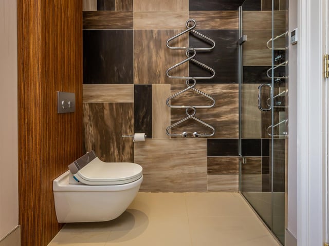 A modern and stylish en suite bathroom awaits.