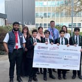 Students with representatives from BBEST Community Hub CIC and Star Coaches of Batley Ltd celebrating a £10,000 partnership to support educational trips for local schools.