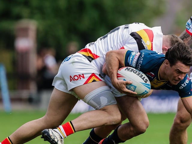 Grade B late contact on passer, three penalty points, total points 3.25 - fine.