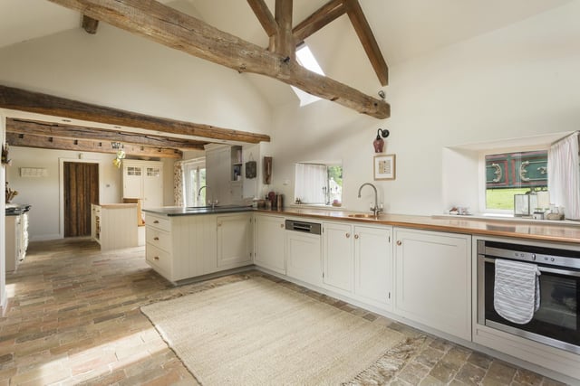 The kitchen is designed and fitted by Stephen Neall Interiors of Harrogate, with handmade painted hardwood units, and Cumberland slate and copper work surfaces. There's an electric four oven Aga, and Neff and Bosch appliances.