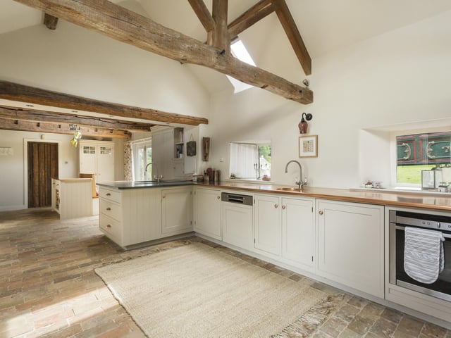 The kitchen is designed and fitted by Stephen Neall Interiors of Harrogate, with handmade painted hardwood units, and Cumberland slate and copper work surfaces. There's an electric four oven Aga, and Neff and Bosch appliances.