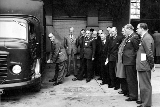 Opening new refuse disposal plant for Aireborough on Milner Road in Yeadon in May 1954. Starting a new cleansing vehicle is Coun E. Cunliffe, chairman of the Health Committee. Coun Norman Wilby, chairman of Aireborough UDC can be seen with chain of office.