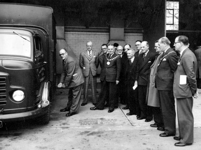 Opening new refuse disposal plant for Aireborough on Milner Road in Yeadon in May 1954. Starting a new cleansing vehicle is Coun E. Cunliffe, chairman of the Health Committee. Coun Norman Wilby, chairman of Aireborough UDC can be seen with chain of office.