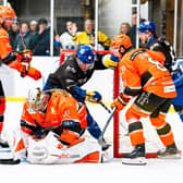 NO WAY THROUGH: Sheffield Steeldogs' goaltender Alex Oldale smothers the puck to thwart a Leeds Knights attack during Sunday night's derby encounter at The Castle. Picture: Kev Bland/Knights Media.